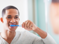 Brushing teeth in the bathroom.
